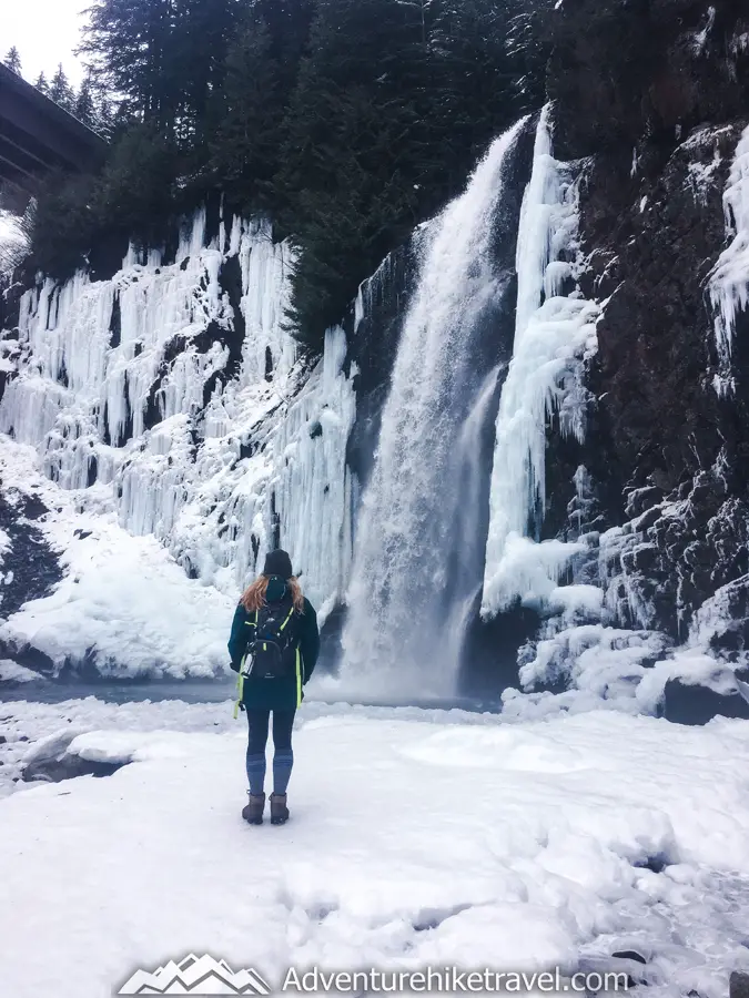 Winter Hike Near Seattle - Franklin Falls. From the snow covered rocks and forest floor to the blue green South Fork Snoqualmie River cascading by, this is a scenic winter hike. I absolutely loved this cute little red cabin sitting by the river. There were also many other tiny cabins that we passed along the way.