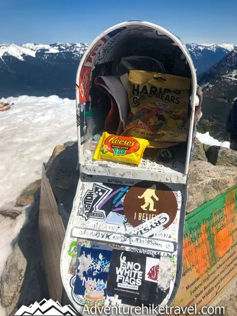 Mailbox Peak. A strenuous day hike near Seattle WA. Bring Something to Leave in the Mailbox One of the Best things about Hiking Mailbox Peak is seeing what surprises are waiting for you in the Mailbox. You never know what will be inside. There are some letters dating back 20+years, stickers, toy's, and a wide range of random treasures and sometimes if you are lucky even beer! Inside the Mailbox is also a Ziplock bag containing a summit register. In this spiral bound journal you can sign your name, date, where you are from and leave a fun note for others to see. It's always fun to flip through and see what others have written in this cool little summit journal. It's definitely recommended not to leave food in the mailbox or item's that can easily corrode and ruin the other item's when I went there was some melted candy in there that had gotten the bottom of the mailbox a bit sticky. Another general unspoken rule is If you take something out of the mailbox leave something else behind in the mailbox for the next hiker.