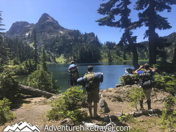 Backpacking Upper Lena Lake - Olympic National Park in Washington State. Upper Lena Lake is a gorgeous alpine lake located in Olympic National Park. This beautiful picturesque lake makes for an excellent summer backpacking destination for adventurous souls. The lake is crystal clear with vivid hues of blue and green. You can see every rock and even several large rainbow trout swimming. This strenuous 14-mile hike with 3,943 feet of elevation gain is not for the beginner hiker. But for those who wish to go on a journey and see some of Olympic National Park's untouched beauty, this is the backpacking destination for you.