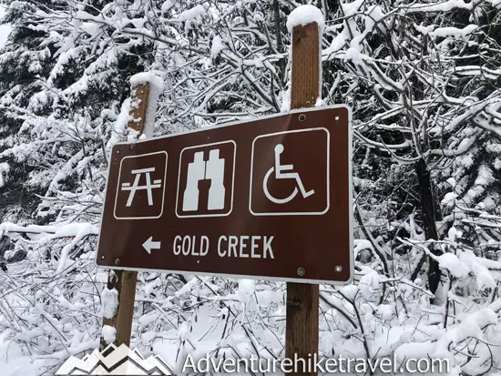 New to snowshoeing? Or just need a fun day-trip getaway? Try snowshoeing the Gold Creek Pond Trail east of Snoqualmie Pass in Washington State. With easy access just off I-90 at Exit 54, you can start snowshoeing through the tall evergreen trees on the edge of the Mount Baker-Snoqualmie National Forest just minutes after parking your car. #hiking #nature #mountains #adventure #travel #traveltips #experiencewa #snowshoeing #pacificnorthwest #wastate #nationalparks #ustravel