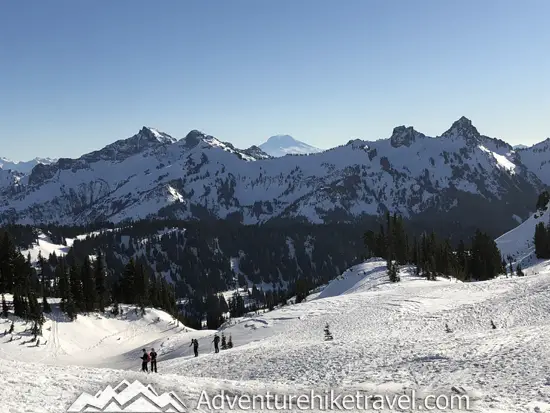 New to snowshoeing? Are you a local living in Washington State or visiting the Pacific Northwest during winter? Want something fun to do? Try snowshoeing at Mt. Rainier National Park.Our First-timer’s Guide to Snowshoeing at Mt. Rainier can give you the information you need to take off on your own snowshoeing adventure. #hiking #nature #mountains #adventure #travel #Mtrainier #traveltips #experiencewa #snowshoeing #pacificnorthwest #wastate #nationalparks #ustravel