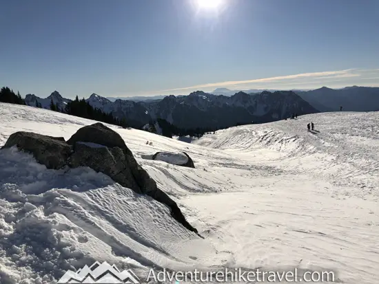 New to snowshoeing? Are you a local living in Washington State or visiting the Pacific Northwest during winter? Want something fun to do? Try snowshoeing at Mt. Rainier National Park.Our First-timer’s Guide to Snowshoeing at Mt. Rainier can give you the information you need to take off on your own snowshoeing adventure. #hiking #nature #mountains #adventure #travel #Mtrainier #traveltips #experiencewa #snowshoeing #pacificnorthwest #wastate #nationalparks #ustravel