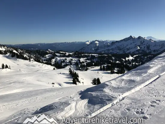 New to snowshoeing? Are you a local living in Washington State or visiting the Pacific Northwest during winter? Want something fun to do? Try snowshoeing at Mt. Rainier National Park.Our First-timer’s Guide to Snowshoeing at Mt. Rainier can give you the information you need to take off on your own snowshoeing adventure. #hiking #nature #mountains #adventure #travel #Mtrainier #traveltips #experiencewa #snowshoeing #pacificnorthwest #wastate #nationalparks #ustravel