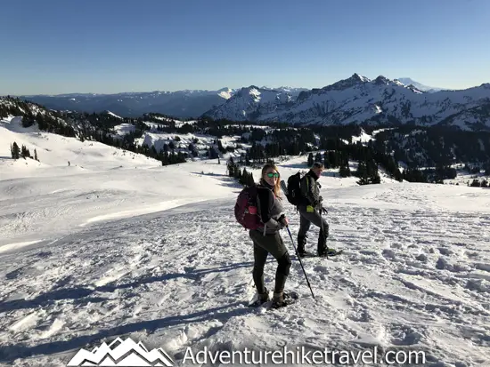 New to snowshoeing? Are you a local living in Washington State or visiting the Pacific Northwest during winter? Want something fun to do? Try snowshoeing at Mt. Rainier National Park.Our First-timer’s Guide to Snowshoeing at Mt. Rainier can give you the information you need to take off on your own snowshoeing adventure. #hiking #nature #mountains #adventure #travel #Mtrainier #traveltips #experiencewa #snowshoeing #pacificnorthwest #wastate #nationalparks #ustravel