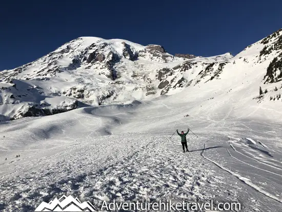 New to snowshoeing? Are you a local living in Washington State or visiting the Pacific Northwest during winter? Want something fun to do? Try snowshoeing at Mt. Rainier National Park.Our First-timer’s Guide to Snowshoeing at Mt. Rainier can give you the information you need to take off on your own snowshoeing adventure. #hiking #nature #mountains #adventure #travel #Mtrainier #traveltips #experiencewa #snowshoeing #pacificnorthwest #wastate #nationalparks #ustravel