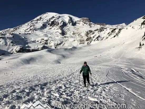 New to snowshoeing? Are you a local living in Washington State or visiting the Pacific Northwest during winter? Want something fun to do? Try snowshoeing at Mt. Rainier National Park.Our First-timer’s Guide to Snowshoeing at Mt. Rainier can give you the information you need to take off on your own snowshoeing adventure. #hiking #nature #mountains #adventure #travel #Mtrainier #traveltips #experiencewa #snowshoeing #pacificnorthwest #wastate #nationalparks #ustravel