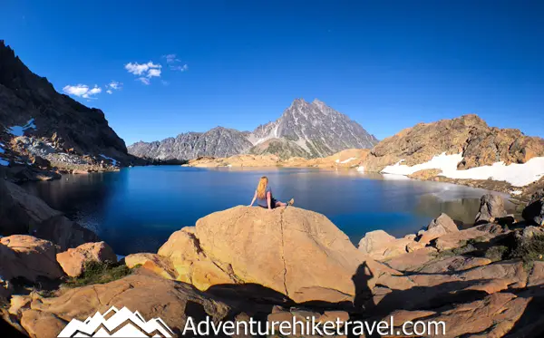 Interested in Backpacking to Lake Ingalls and Headlight Basin in the Alpine Lakes Wilderness? Lake Ingalls is a stunning alpine lake located in the heart of the Alpine Lakes Wilderness of Washington State, offering a challenging yet rewarding backpacking experience for outdoor enthusiasts. With its crystal clear blue-green water and the impressive view of Mount Stuart, the second tallest non-volcanic peak in Washington looming above Lake Ingalls, is impressive, to say the least.