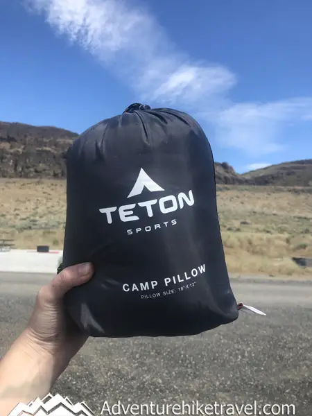 Are you tired of stuffing your clothing into a makeshift pillow while camping or tired of bringing large bulky pillows on trips or considering upgrading your travel pillow? In this Gear Review Of The TETON Sports Camp Pillow, we will cover all the pros and cons of this camp pillow and its best features to help you decide if this pillow is a good fit for your travel adventures.