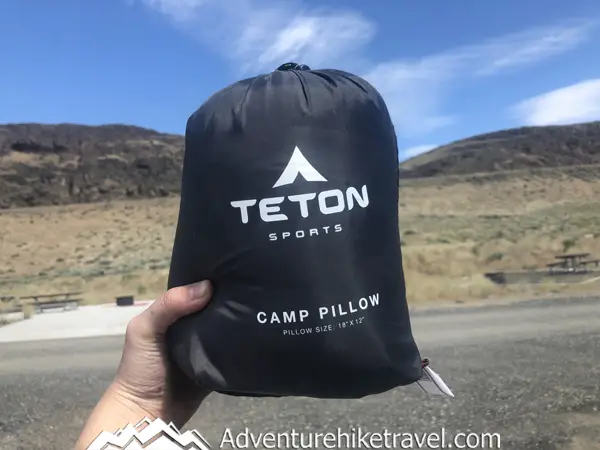 Are you tired of stuffing your clothing into a makeshift pillow while camping or tired of bringing large bulky pillows on trips or considering upgrading your travel pillow? In this Gear Review Of The TETON Sports Camp Pillow, we will cover all the pros and cons of this camp pillow and its best features to help you decide if this pillow is a good fit for your travel adventures.