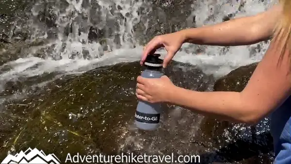 Stay healthy while traveling! Get a reliable Water-to-Go filter bottle for clean water on hikes and adventures. Don't risk getting sick from waterborne bacteria or parasites like Giardia. Read our gear review in the blog post.