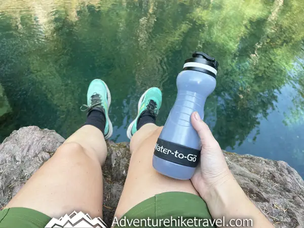 Stay healthy while traveling! Get a reliable Water-to-Go filter bottle for clean water on hikes and adventures. Don't risk getting sick from waterborne bacteria or parasites like Giardia. Read our gear review in the blog post.