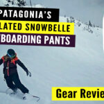 Snowboarder wearing Patagonia Women’s Snowbelle Pants in snowy mountains