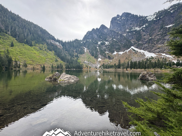 This 4.7-mile Washington trail leads to Heather Lake, where hikers are treated to wildflowers, waterfall crossings, and sweeping alpine lake views nestled below Mount Pilchuck.