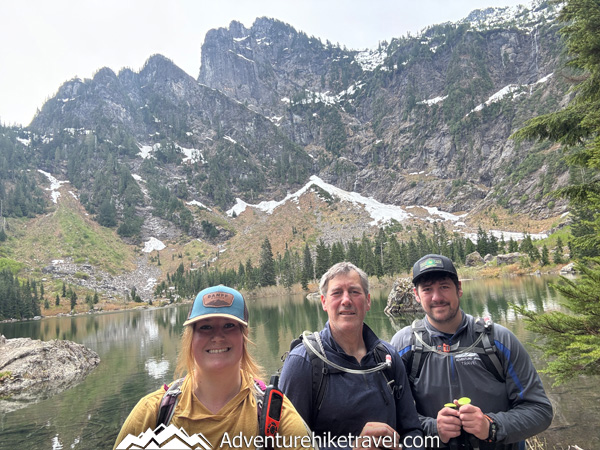 Hike to Heather Lake in Washington for a scenic 4.7-mile trail featuring old-growth forest, waterfalls, wildflowers, and a peaceful alpine lake in the North Cascades.