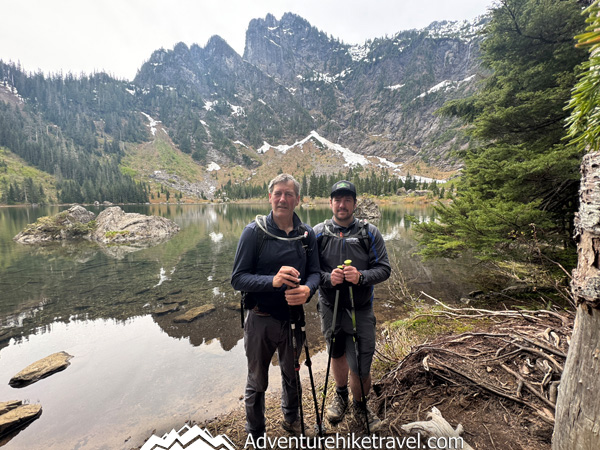 Heather Lake offers one of Washington’s most rewarding alpine lake hikes with waterfalls, towering evergreens, and postcard-worthy mountain reflections at the lake.