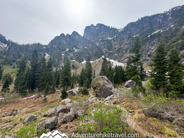 Hike to Heather Lake in Washington for a scenic 4.7-mile trail featuring old-growth forest, waterfalls, wildflowers, and a peaceful alpine lake in the North Cascades.