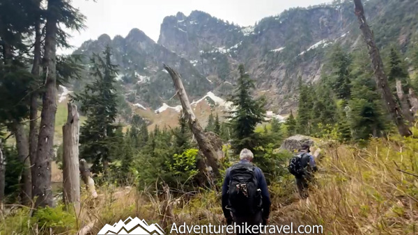 Heather Lake is a must-hike Washington trail featuring moss-draped trees, flowing creeks, wooden bridges, and breathtaking alpine scenery just 90 minutes from Seattle.
