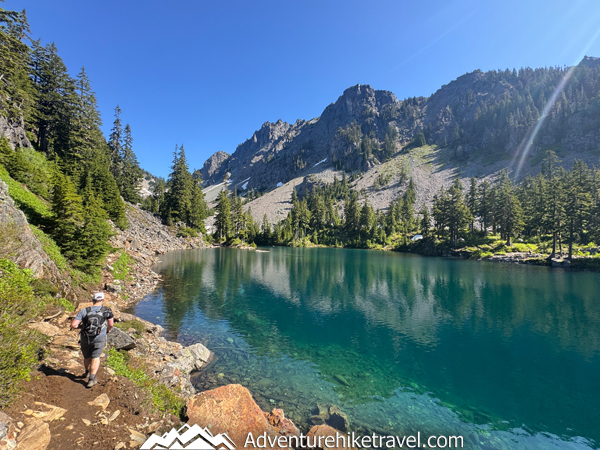If you’re searching for an unforgettable day hike near Snoqualmie Pass, Melakwa Lake is it! This Alpine Lakes Wilderness trail offers lush forests, rushing rivers, waterfalls, a natural rock waterslide, rugged terrain, and a jaw-dropping turquoise alpine lake framed by dramatic peaks. #MelakwaLakeHike