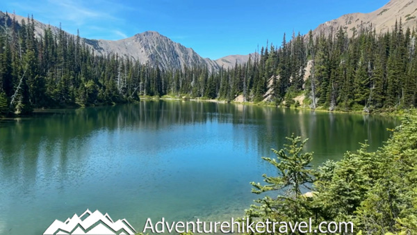 Discover the beauty of Royal Lake on this scenic hike in Olympic National Park. The trail winds through towering firs, moss-covered trees, and along sparkling creeks before opening to the breathtaking alpine lake. Learn about trail distance, difficulty, camping spots, and tips for exploring this iconic part of the Royal Basin Trail. Ideal for backpackers and adventurous day hikers.