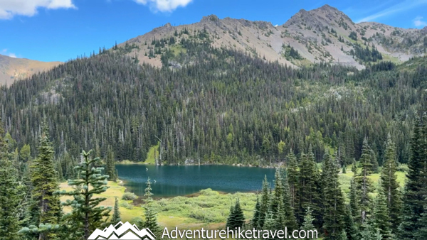 Turquoise Moose Lake in Olympic National Park surrounded by alpine peaks and ridgelines