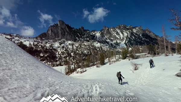 Looking for spring trail conditions in the Enchantments? This post shares our real trail experience backpacking the Snow Lakes Trail to the Core Zone in mid-May near Leavenworth, Washington. Includes snow conditions, mileage, elevation gain, trail landmarks, gear, mountain goat sightings, frozen alpine lakes, and what to expect during early season backpacking in Washington State.