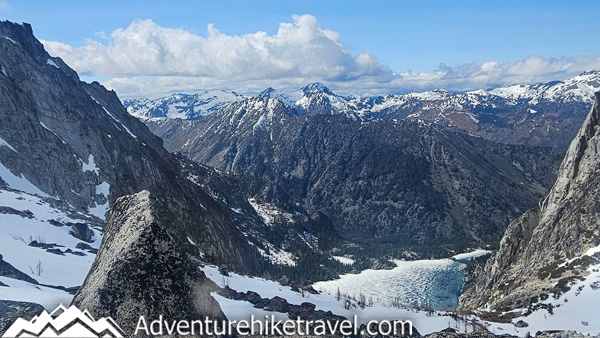 Get detailed trail information from our spring backpacking trip through the Enchantments via the Snow Lakes Trail to the Core Zone. This post covers mid-May trail conditions near Leavenworth, WA, including mileage, elevation gain, snow travel, route highlights, gear needed, and what conditions looked like above Snow Lakes during early season backpacking in Washington’s Alpine Lakes Wilderness.