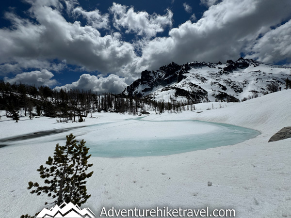 Sharing detailed trail information from our spring backpacking trip through the Enchantments via the Snow Lakes Trail to the Core Zone near Leavenworth, Washington. This post covers mid-May trail conditions, snow travel above Snow Lakes, mileage, elevation gain, route highlights, waterfalls, alpine lakes, and the gear we used for early season backpacking in Washington’s Alpine Lakes Wilderness.